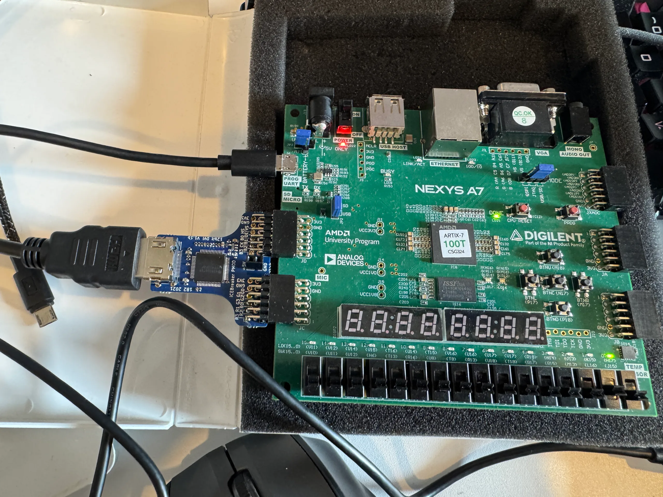 Nexys A7 with iCEBreaker 12-bit DVI PMOD on JC and JD, HDMI connected, DONE lit.