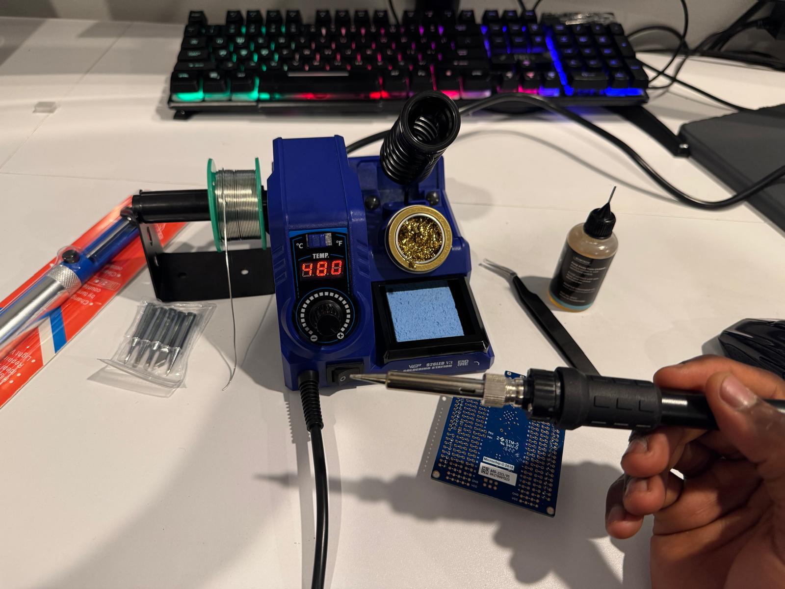 WEP 926LED V3 on the desk — display at 480, iron over a small Microchip board.